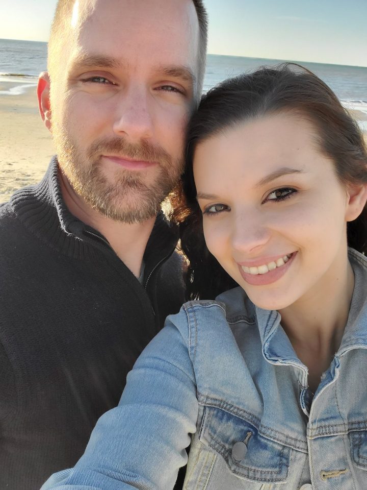 Troy and his wife at the beach
