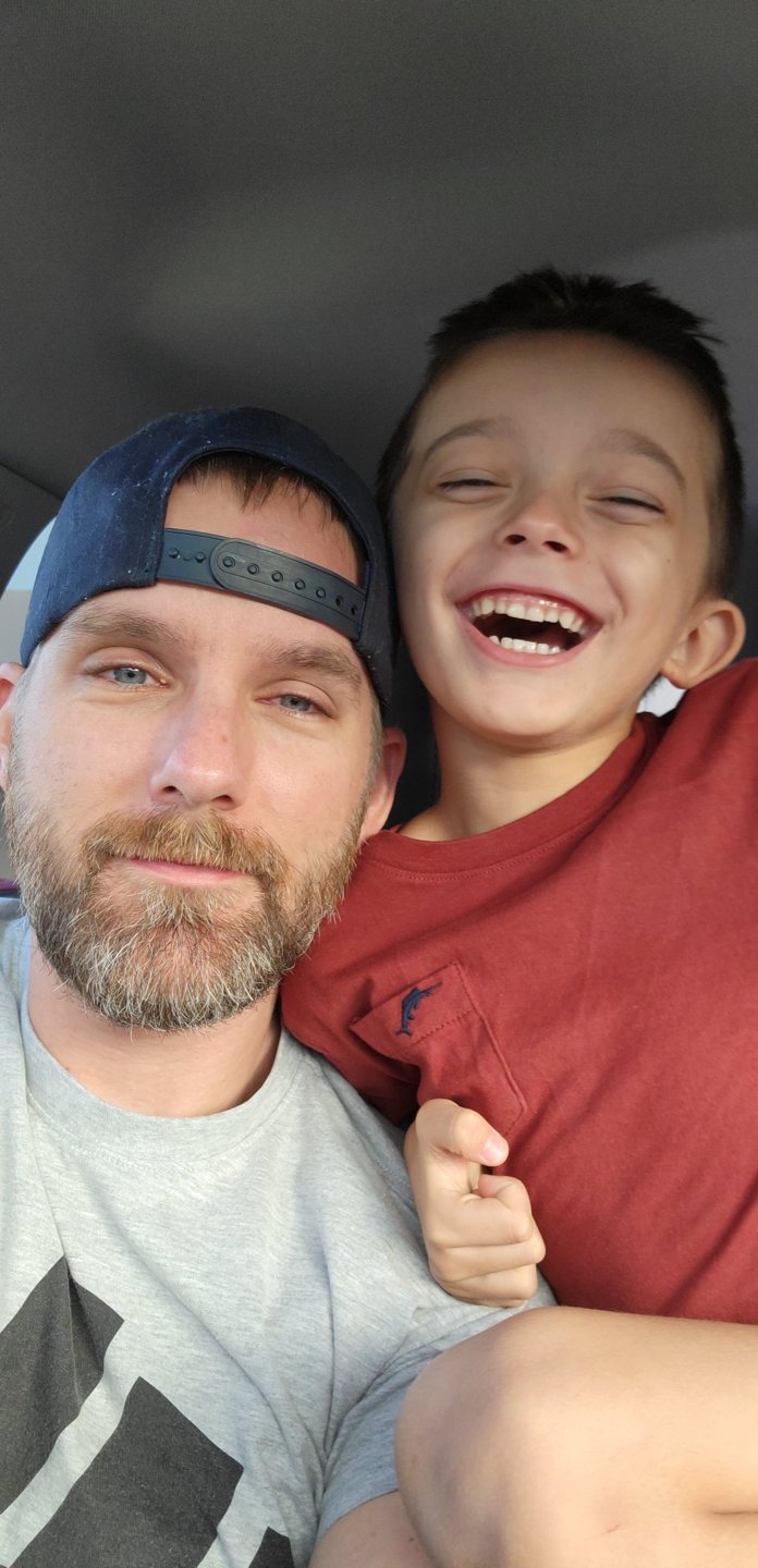 Troy with his smiling son