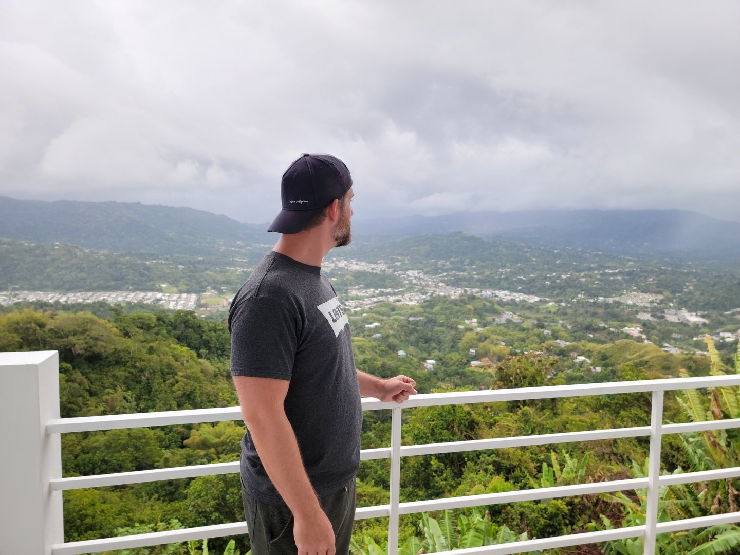 Troy looking across a green valley in Puerto Rico